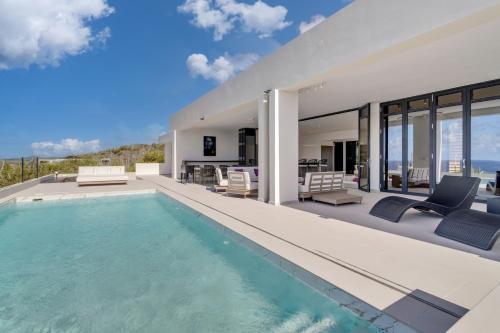 an image of a house with a swimming pool at Villa Regatta in Hato