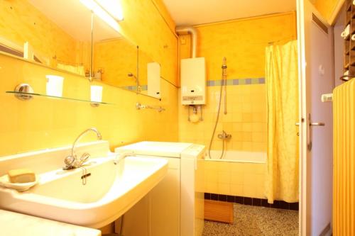 a bathroom with a sink and a shower and a tub at Private Apartment in Hannover