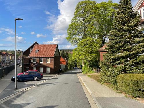 a car parked on the side of a street with houses at Liebevoll eingerichtetes Ferienzimmer mit großen Garten in Clausthal-Zellerfeld