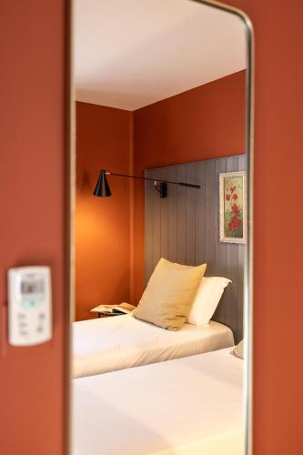 Кровать или кровати в номере Naâd Hotel Sarlat Centre Ville