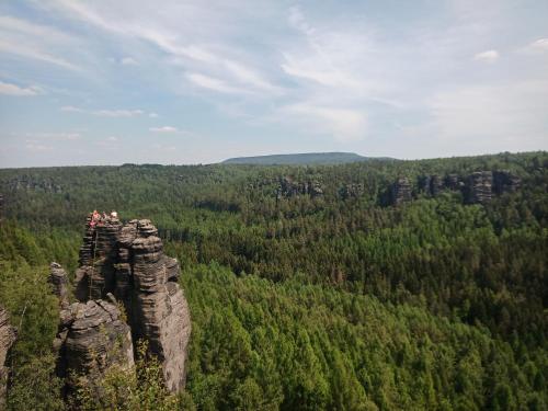 a group of people standing on top of a rock formation at Fox House Tisá / Rájec in Tisá