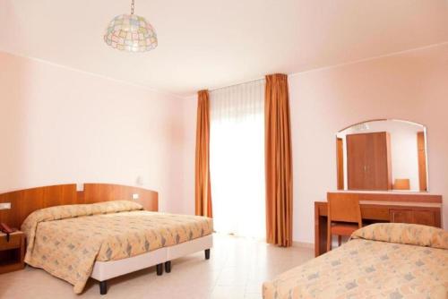Postel nebo postele na pokoji v ubytování Hotel Meridiano