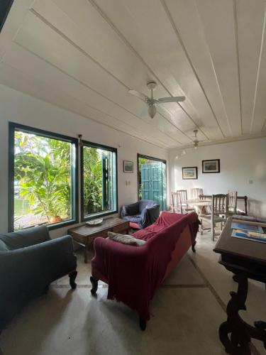 a living room with a couch and a table at CASA FLOR DO RIO in Paraty