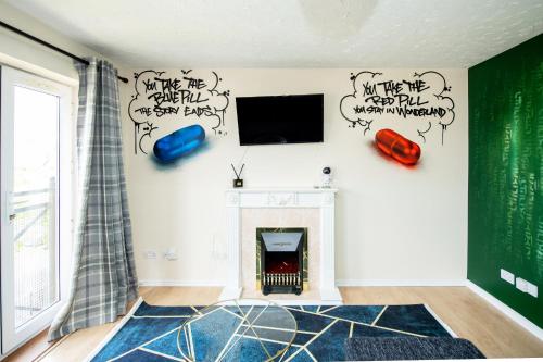a living room with graffiti on the wall at Escape The Matrix - 2 Bed Flat in City Centre with Free Parking in Southampton