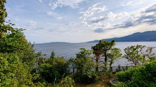 a view of a large body of water with trees at Aparatman Residence in Rijeka