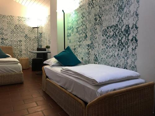 Postel nebo postele na pokoji v ubytování Sleep In Venzone Depandance