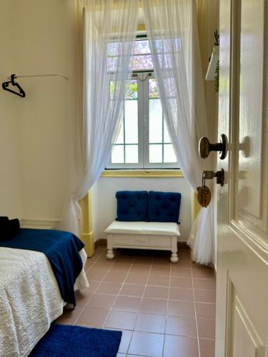 Postel nebo postele na pokoji v ubytování Ti Maria Guest House