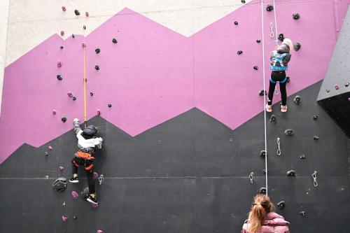 a group of people on a climbing wall at Familienhotel Familiamus in Maranza