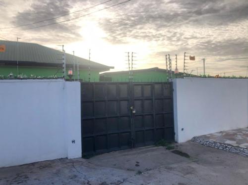 a black and white fence in front of a building at nanas@TEMA C11 in Tema