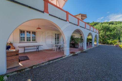 an external view of a house with a patio at La Palazzina nel Verde - Goelba in Campo nell'Elba