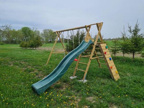 a playground with a slide and a ladder at Hiiemäe Puhkemaja in Kunda