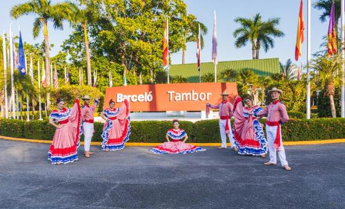 a group of people dancing in the street at Barceló Tambor - All Inclusive in Tambor