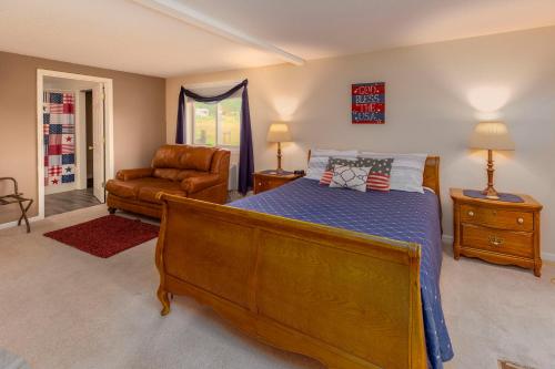 a bedroom with a bed and a couch and a chair at Sweetgrass Inn Bed & Breakfast in Rapid City