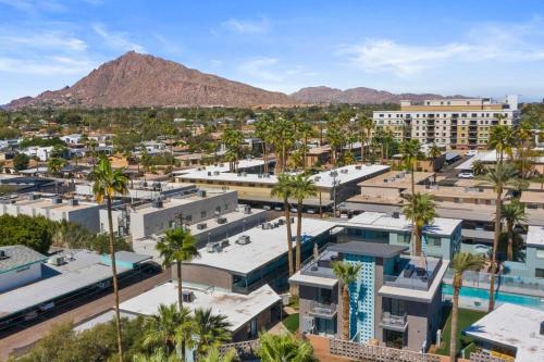 an aerial view of a city with palm trees and buildings at Walkable OTS, Heated Poolside Mid Century Condo in Scottsdale