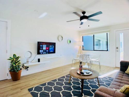 a living room with a couch and a table at Primo Old Town Location w/ Heated Pool in Scottsdale