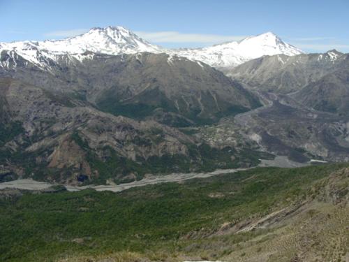 a view of a mountain range with snow covered mountains at Turismo El Recodo, cabañas y camping in San Clemente