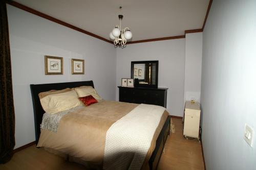 a bedroom with a large bed in a room at Tito's Place in Ohrid