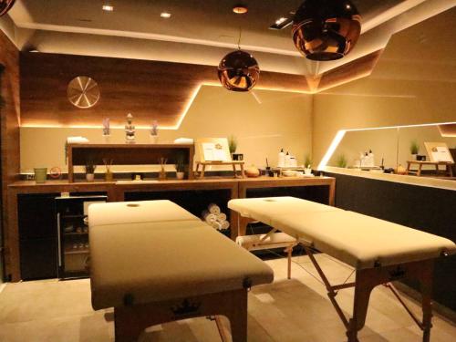 a room with two stools and a counter in a store at BOUTIQUE 25h by Eva stay 018 in Niš