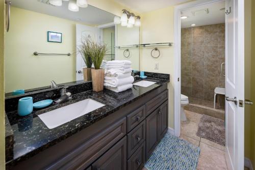 a bathroom with a sink and a shower at Nautilus 1203 - Gulf Front 2 Bedroom! 2nd Floor! Free Beach Service March to October in Fort Walton Beach