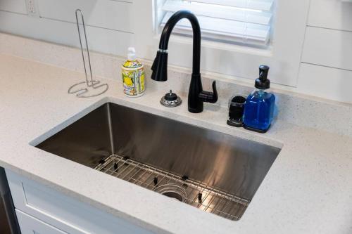 a stainless steel sink in a kitchen counter at Beach Getaway at Jax Beach Studio Apartment in Jacksonville Beach