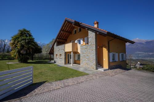 a house with a fence in front of it at Casa Bellavista 1 in Colico