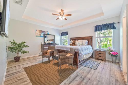 a bedroom with a bed and a table and chairs at CHEERFUL VILLA 4 BEDROOM AND A HOT TUB in Cape Coral