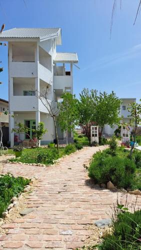 a brick road in front of a building at LaWanda9 in Vama Veche