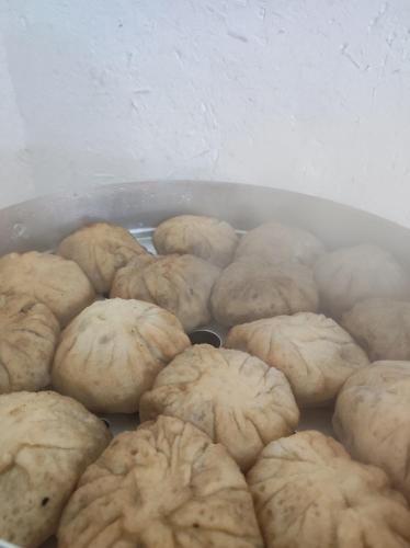 a bunch of cookies in a pan on a table at Eco Village Lodge in Dzhetyoguz