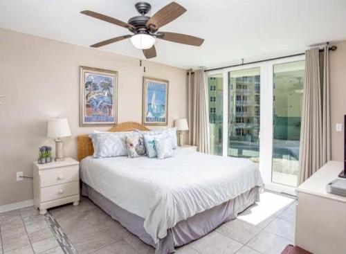 a bedroom with a bed and a ceiling fan at Nautilus 2310 Gulf View 2 Bedroom 3rd Floor Free Beach Service in Fort Walton Beach