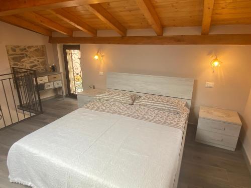 Postel nebo postele na pokoji v ubytování Casa Dell’Angelo Serafino