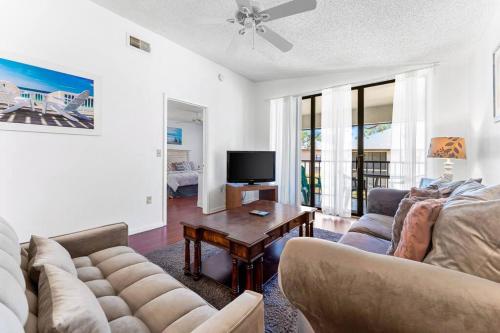 a living room with a couch and a table at Minutes to Anna Maria Island in Bradenton