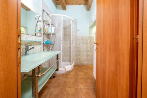 a bathroom with a sink and a mirror at La Suite del Borgo in Viterbo