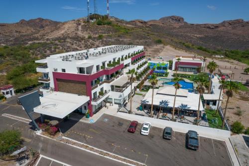 an aerial view of a building with a parking lot at Sawari Hotel in San Carlos