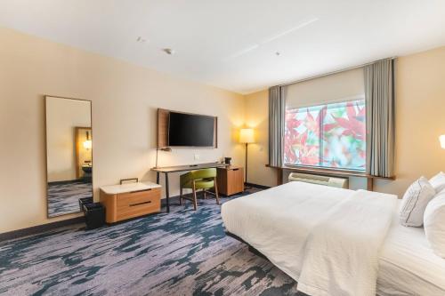 a hotel room with a bed and a desk at Fairfield Inn & Suites by Marriott Corpus Christi Central in Corpus Christi