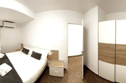 A bed or beds in a room at Citadella Apartment