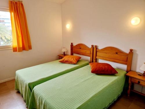 Llit o llits en una habitació de Apartamento a un paso de playa