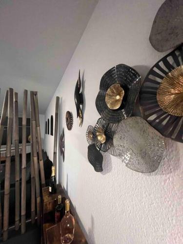 a wall with a bunch of decorations on it at Modernes Apartment mit 75qm mit Balkon & Aussicht in Aachen