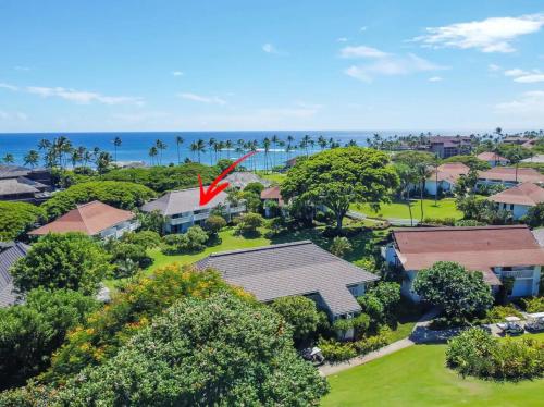 an aerial view of a house with a red flag at Kiahuna Plantation Unit 42, Air Conditioning, 2 Minute Walk to Beach in Koloa