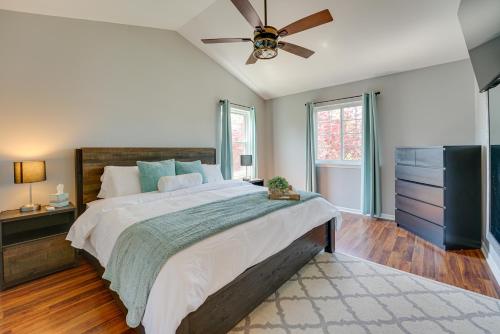 a bedroom with a large bed and a ceiling fan at Pet-Friendly Vacation Rental in Wixom with Hot Tub! in Wixom