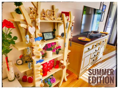 a room with a kitchen with a summer edition shelf at Matsa Apartment in Evergreen complex in Varna City