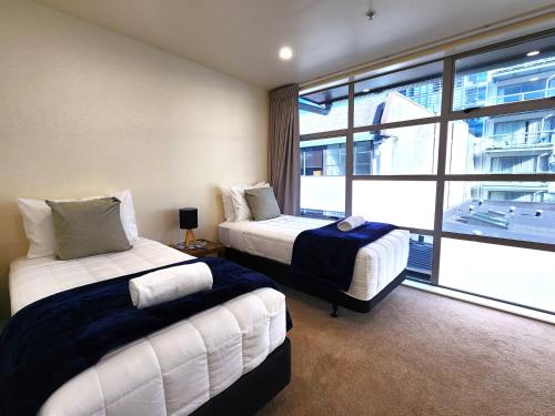 Katil atau katil-katil dalam bilik di U Suites on Jessie