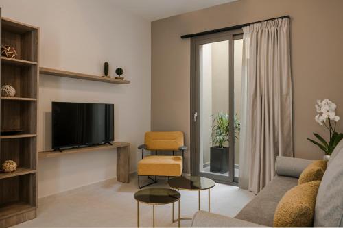 Телевизор и/или развлекательный центр в Anthemis Living