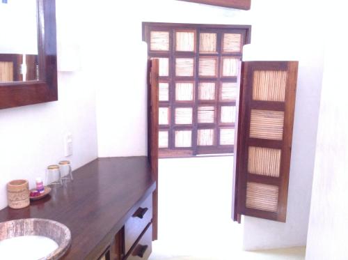 a bathroom with a sink and a mirror at Casa Flor de Mar in Zipolite