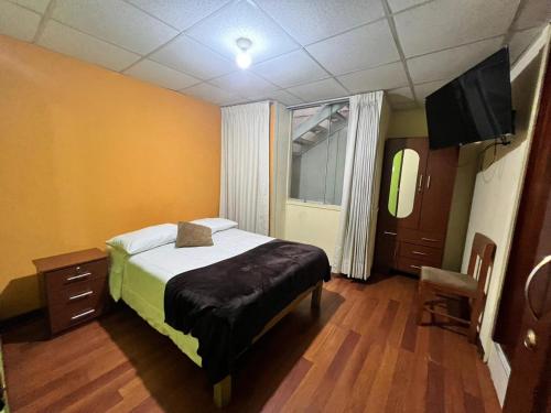Ένα ή περισσότερα κρεβάτια σε δωμάτιο στο Hostal Orosheam