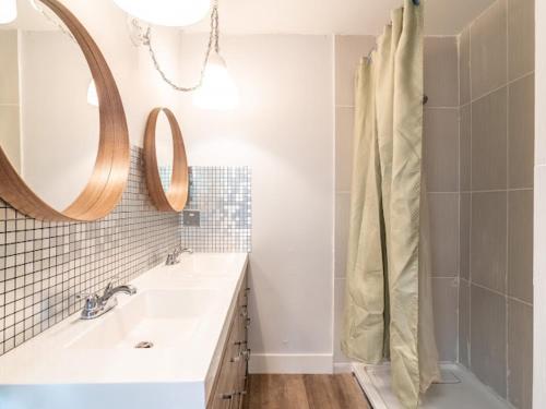 a bathroom with a sink and a mirror and a shower at Cozy Private Home single rooms in Halifax