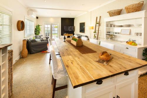 a large kitchen with a large wooden counter top at The Edward Townhouses 151 - 157 in Orange