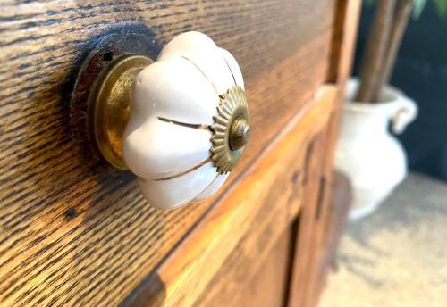 a close up of a door knob on a wooden door at The Edward Townhouses 151 - 157 in Orange