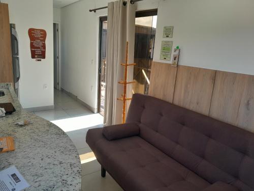 a living room with a couch and a table at Pousada Recanto do Aconchego in Florianópolis