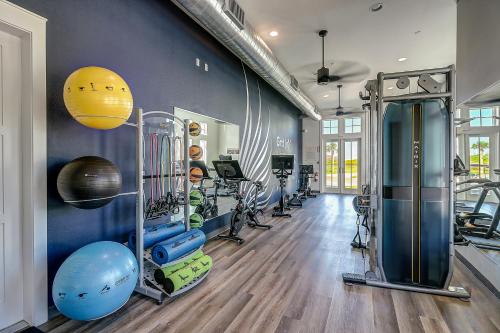 a gym with several treadmills and exercise machines at Fairway to Heaven in Port Aransas