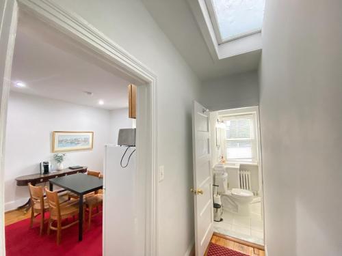 a kitchen and dining room with a table and a refrigerator at Good Night Sleep 1Bdrm 2 Queen Beds in Washington, D.C.